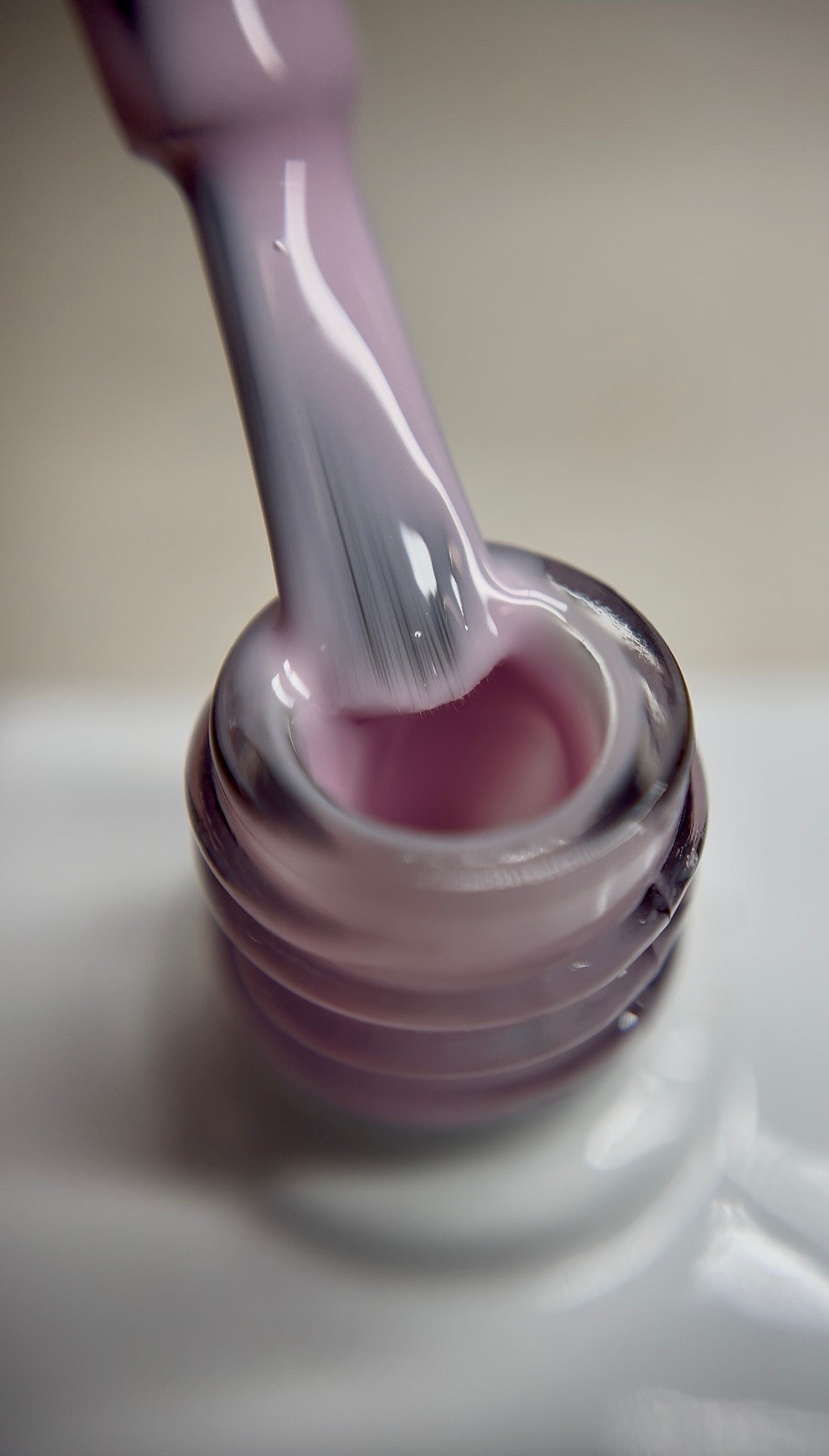 Soft baby pink translucent gel polish with a sheer finish and neutral undertone. A delicate nude shade for professional salon use, ideal for natural nail looks, French bases, and layered designs. Smooth application with thin layers. TPO-free and HEMA-free.