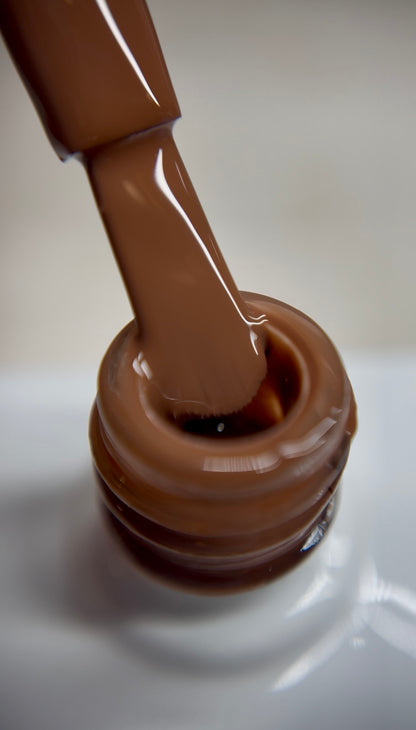 Rich chocolate brown nude gel polish with a warm undertone and creamy finish. A bold nude shade for professional salon use, ideal for statement nude sets, elegant designs, and deeper skin tones. Smooth coverage with thin layers. TPO-free and HEMA-free.