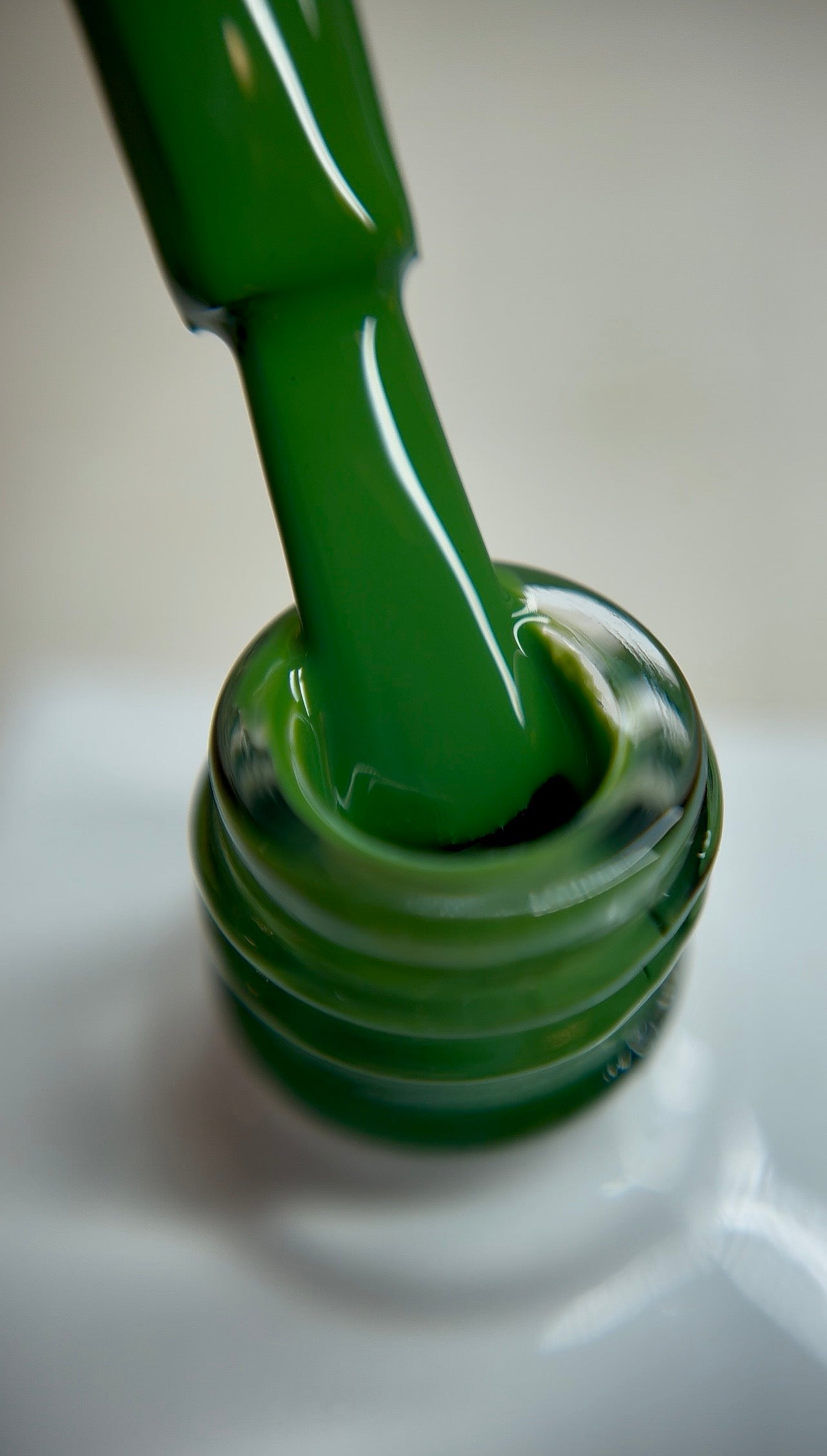 Deep forest green gel polish with a rich cool undertone and creamy finish. A bold, elegant shade for professional salon use, ideal for statement nail sets, modern designs, and seasonal looks. Smooth coverage with thin layers. TPO-free and HEMA-free.